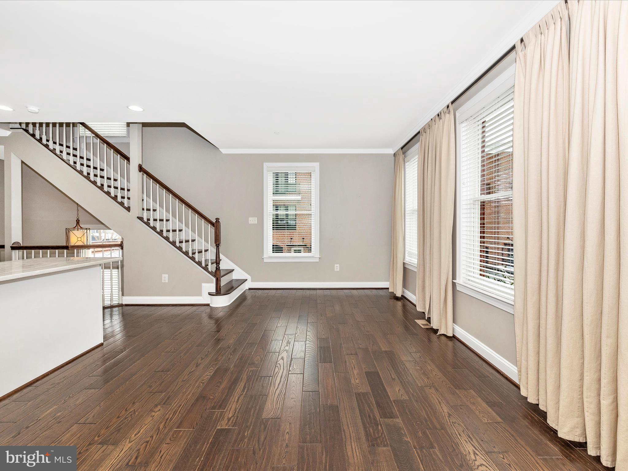 2 Maxwell Square Frederick, MD 21701 - Photo 10 of 59 a view of an entryway with wooden floor and stairs