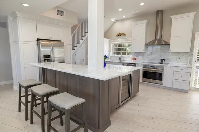 a white toilet sitting next to a bathroom sink