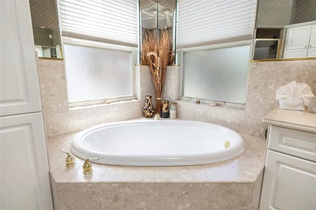 a bathroom with a toilet sink and shower