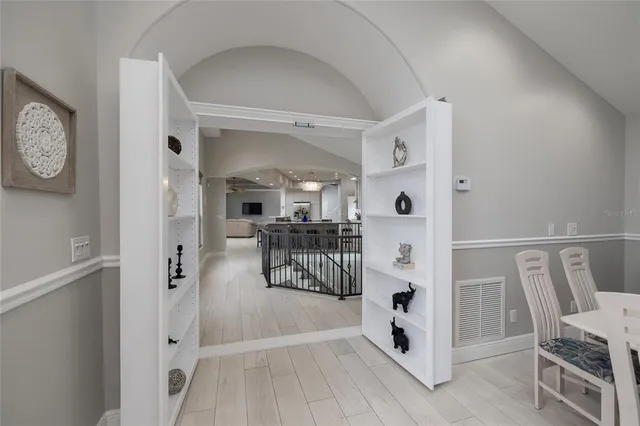 a view of a swimming pool with a deck and a garden