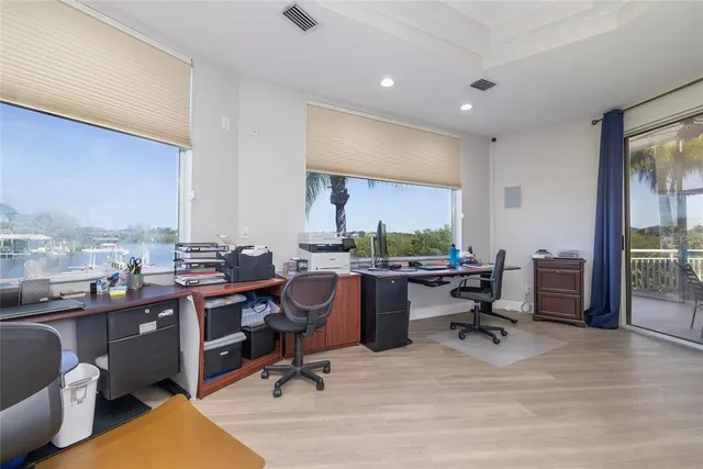 a view of a balcony with two chairs