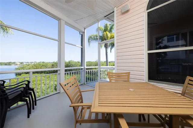 a view of a patio with table and chairs with wooden floor and chair