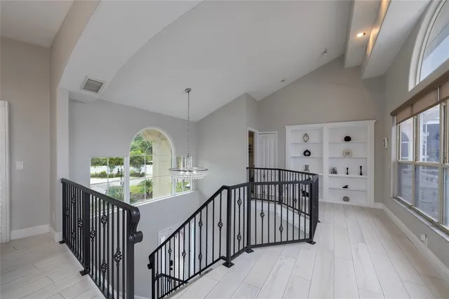a kitchen with a sink stove cabinets and refrigerator