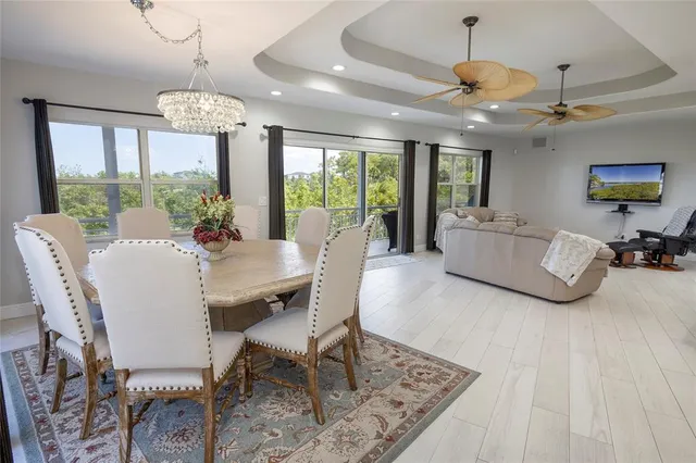 a kitchen with a sink dishwasher a stove and a refrigerator with wooden floor