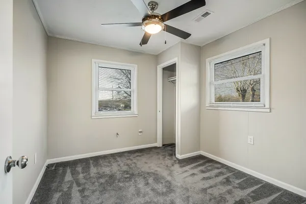 a view of an empty room with a window