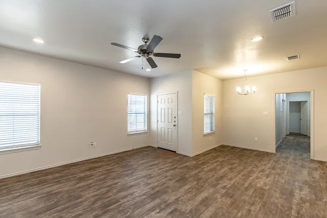 a view of an empty room with a window