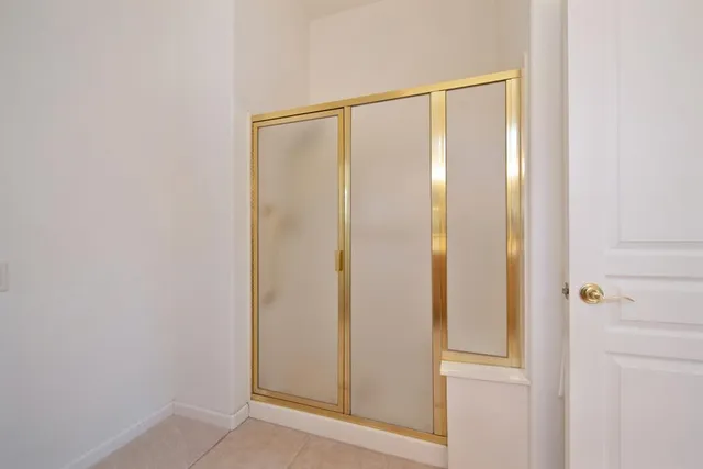 a view of a room with water heater on the wall
