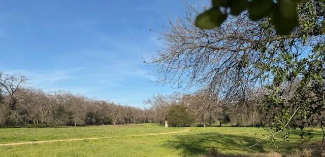a front view of a building with sitting area