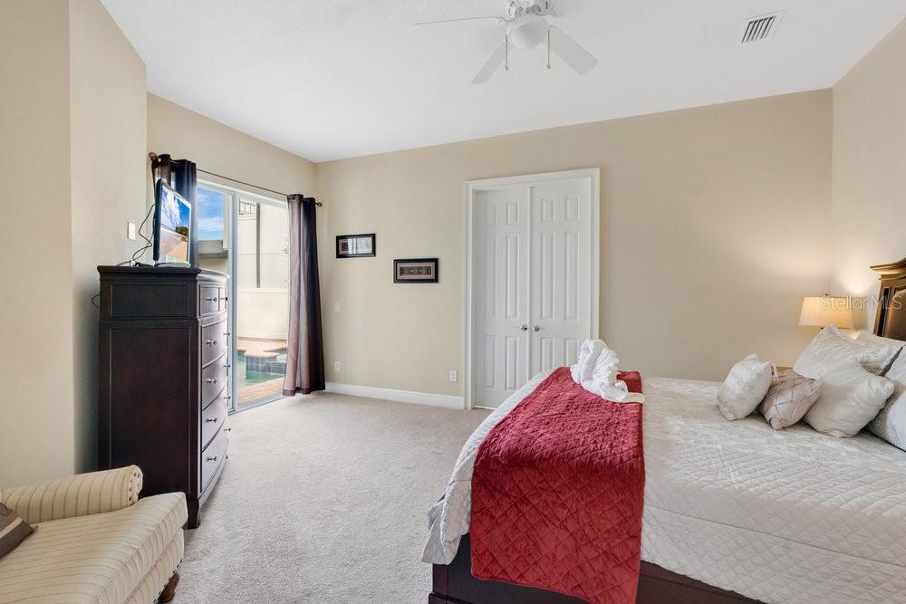 7404 Oconee Street Reunion, FL 34747 - Photo 11 of 87 a bedroom with a bed and a couch