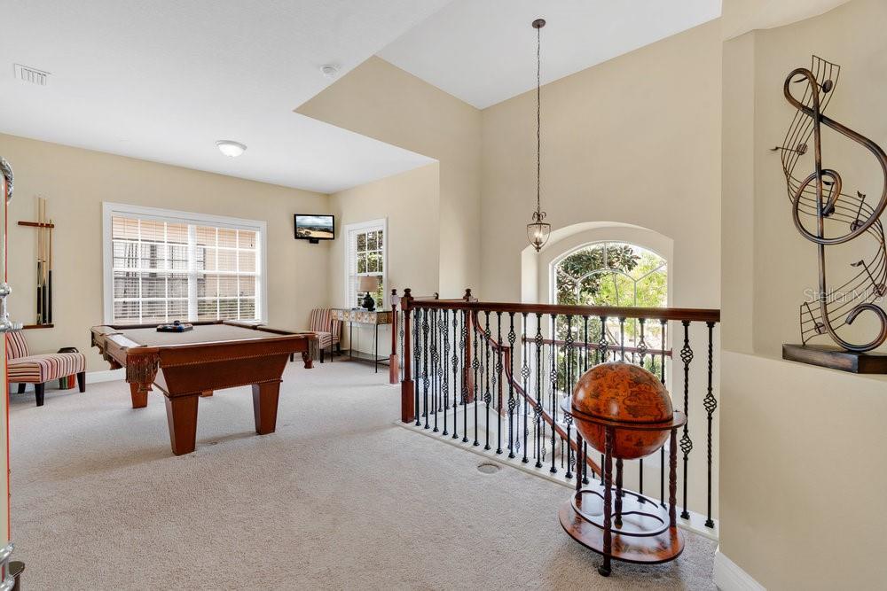 7404 Oconee Street Reunion, FL 34747 - Photo 20 of 87 a room with furniture a window and a chandelier