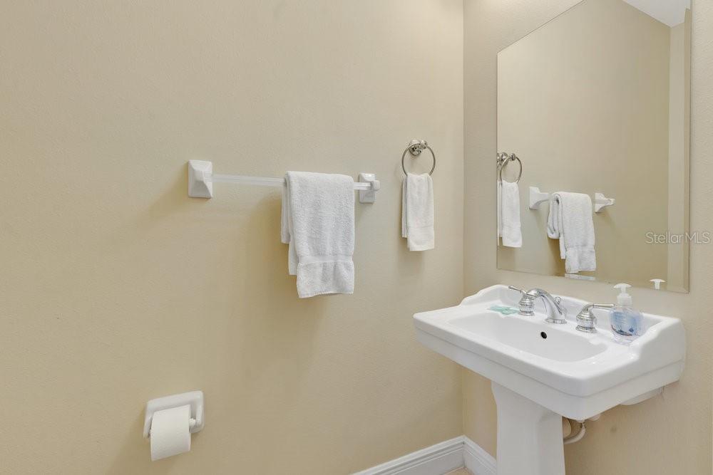 7404 Oconee Street Reunion, FL 34747 - Photo 21 of 87 a bathroom with a sink and a mirror