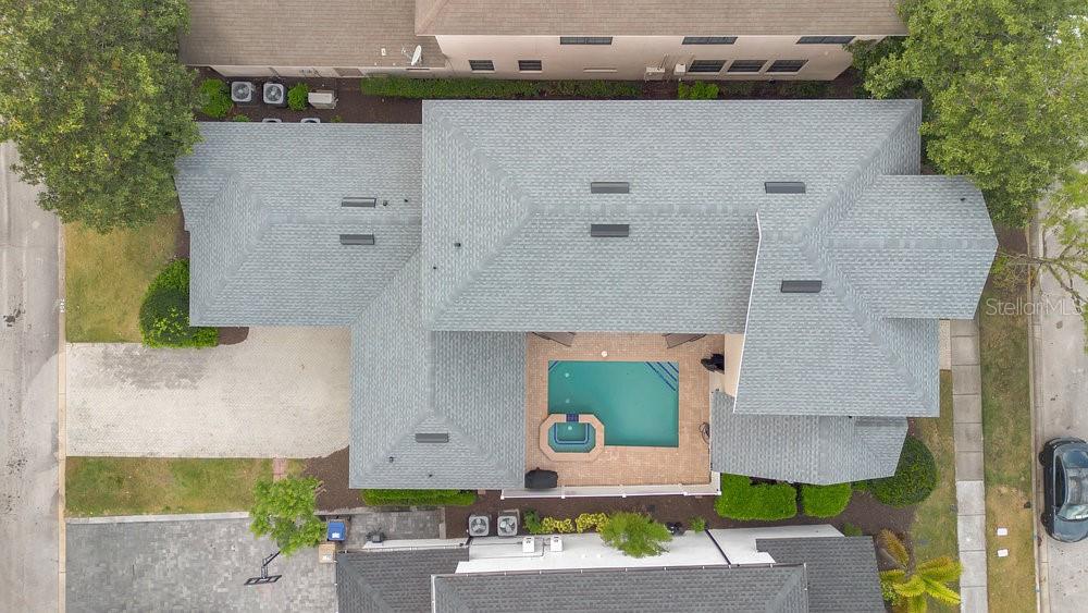 7404 Oconee Street Reunion, FL 34747 - Photo 26 of 87 an aerial view of a house with a garden and yard