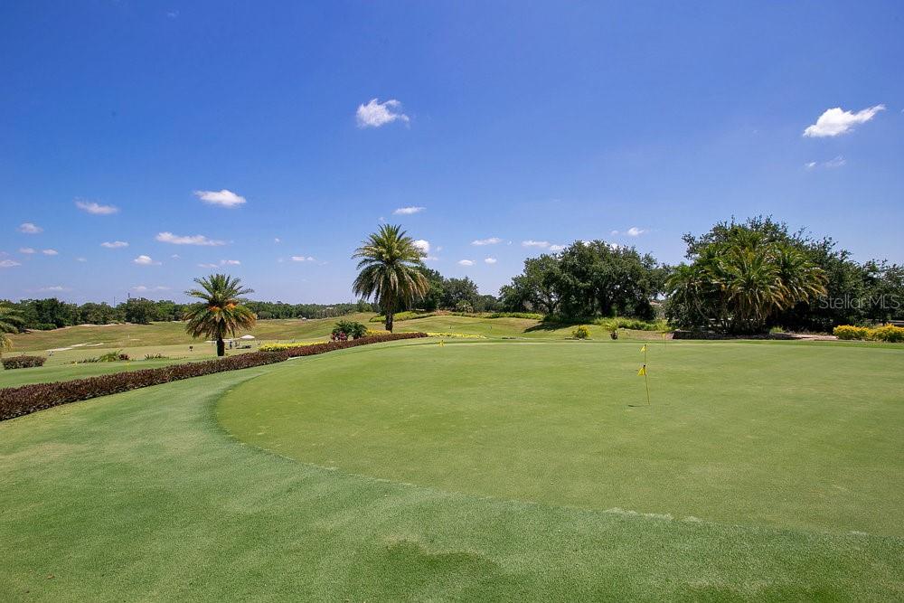 7404 Oconee Street Reunion, FL 34747 - Photo 35 of 87 a view of a golf course with a lake