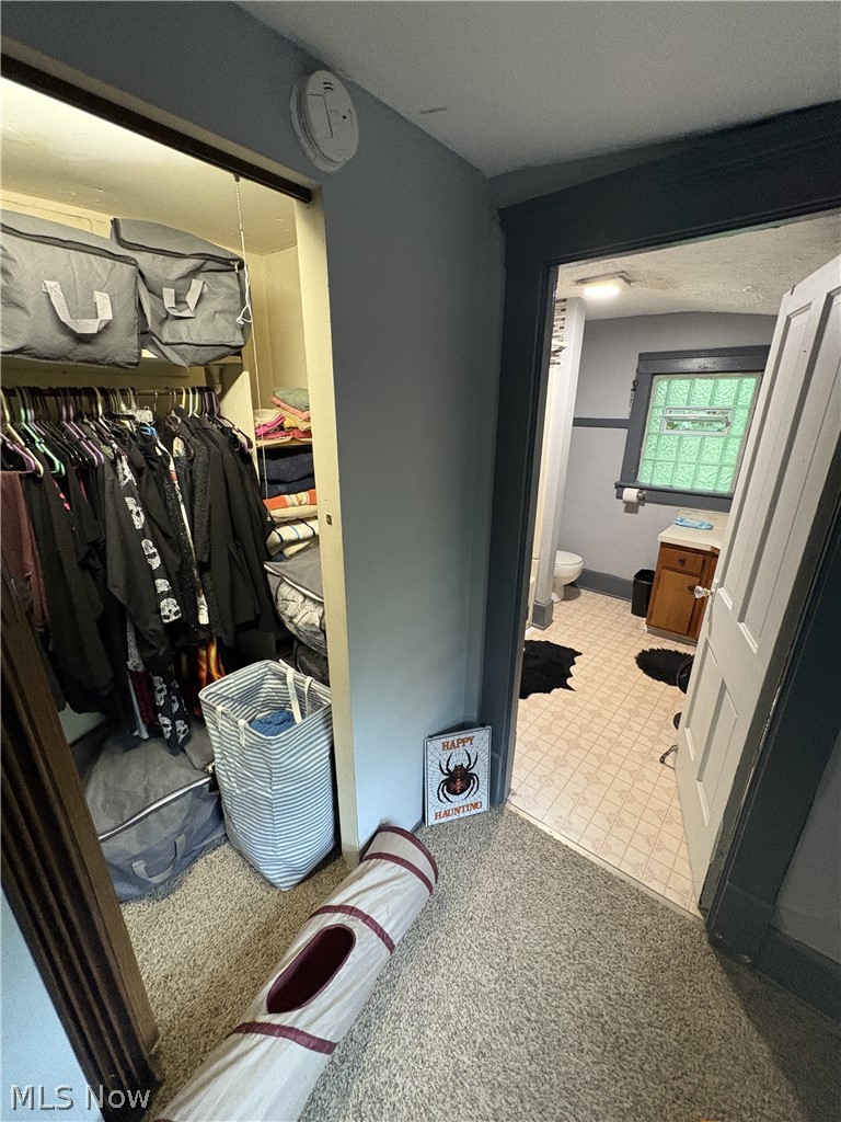 727 Wooster Road North Barberton, OH 44203 - Photo 26 of 37 729 (1-Bed) - Closet and Bathroom