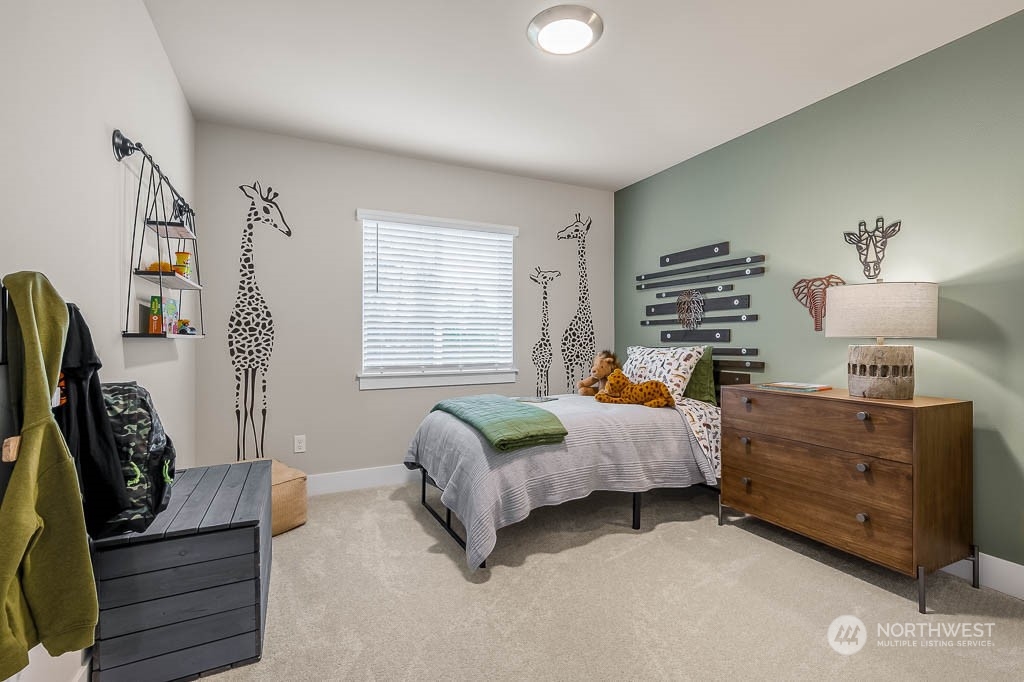 22905 20th Place West Bothell, WA 98021 - Photo 21 of 26 a bedroom with furniture and a window