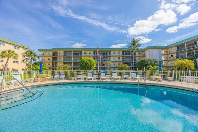 a view of a house with a swimming pool and outdoor space