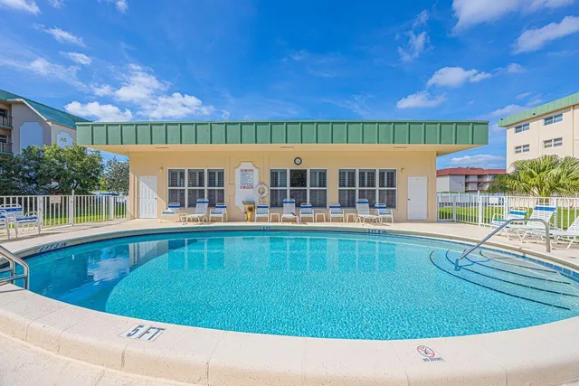 a view of a swimming pool with a lounge chairs