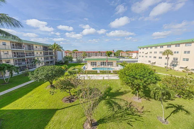 a view of a swimming pool with a garden