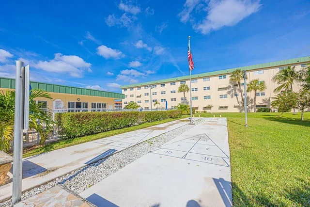 a view of a building with a yard