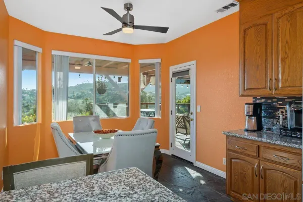 a room with patio furniture and a window