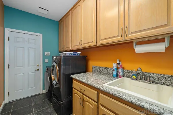 a kitchen with a refrigerator and cabinets