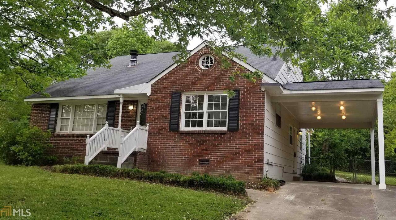 10666 Thrasher Road Hampton, GA 30228 - Photo 1 of 1 a front view of a house with garden