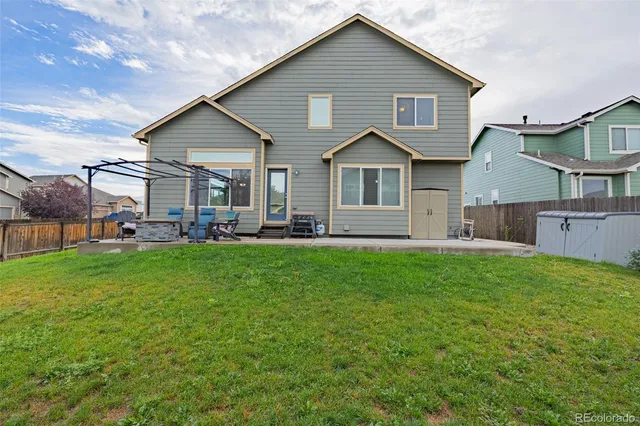 a front view of a house with a yard and porch
