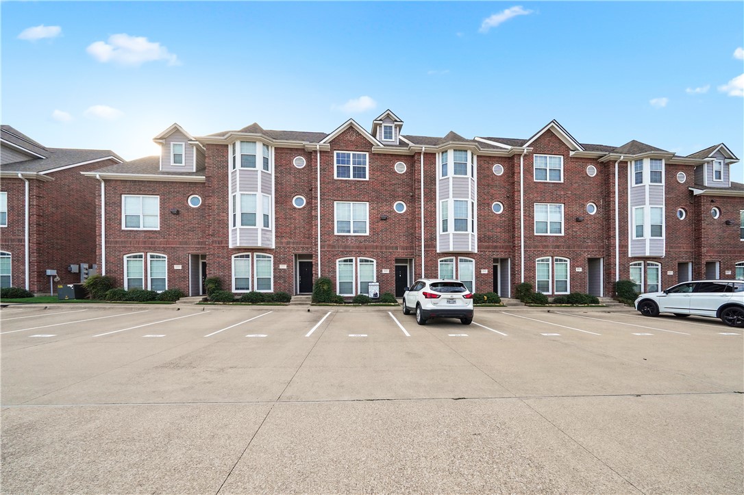 1198 Jones-Butler Road College Station, TX 77840 - Photo 5 of 21 View of building exterior with uncovered parking