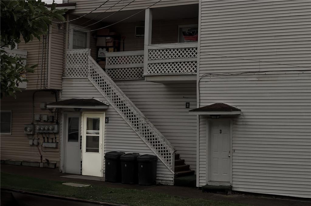 221 2nd Street, Unit 5 Smithton, PA 15479 - Photo 2 of 13 a front view of a house with a garage