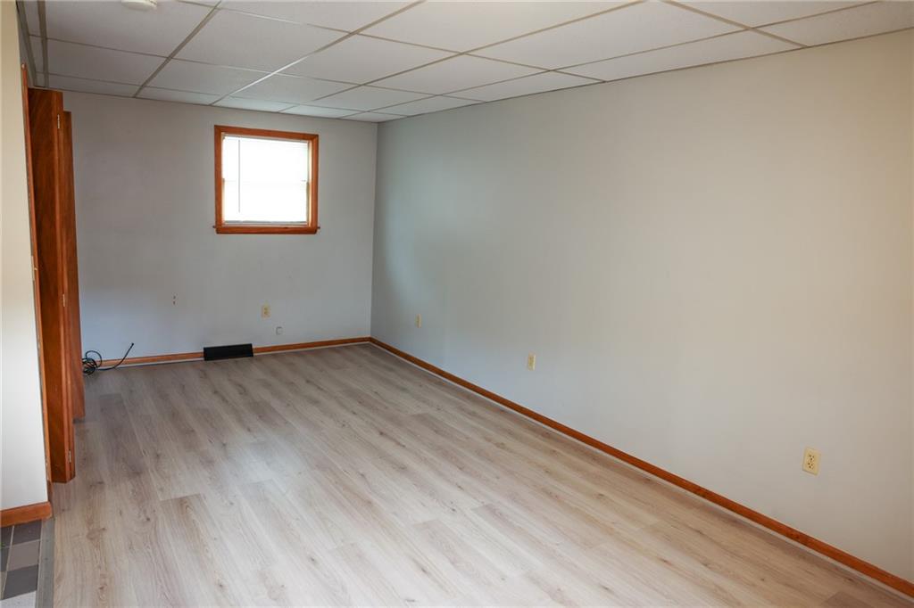 221 2nd Street, Unit 5 Smithton, PA 15479 - Photo 6 of 13 an empty room with wooden floor and windows