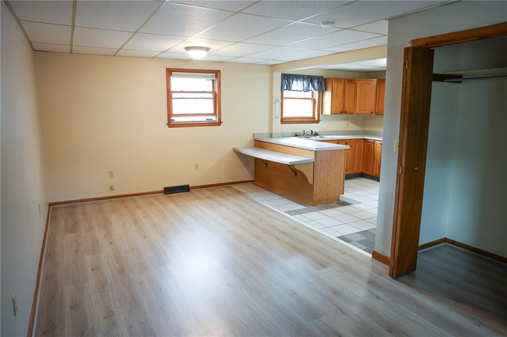 221 2nd Street, Unit 5 Smithton, PA 15479 - Photo 7 of 13 a view of kitchen and hall with wooden floor