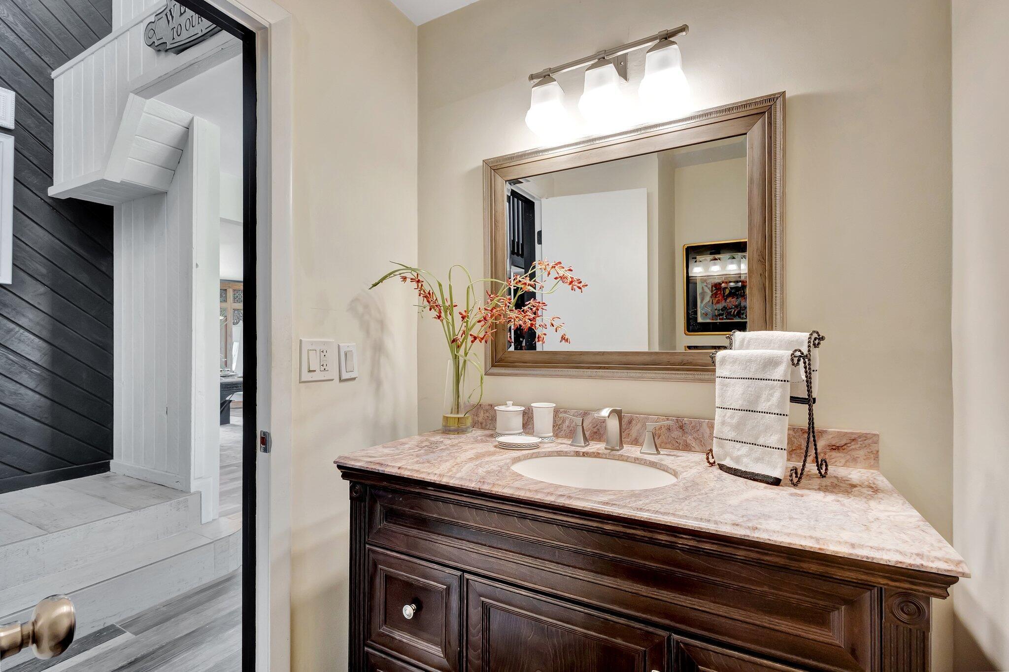 5446 Reynolds Road Lake Worth, FL 33449 - Photo 14 of 57 a en suite bathroom with a granite countertop sink and a mirror