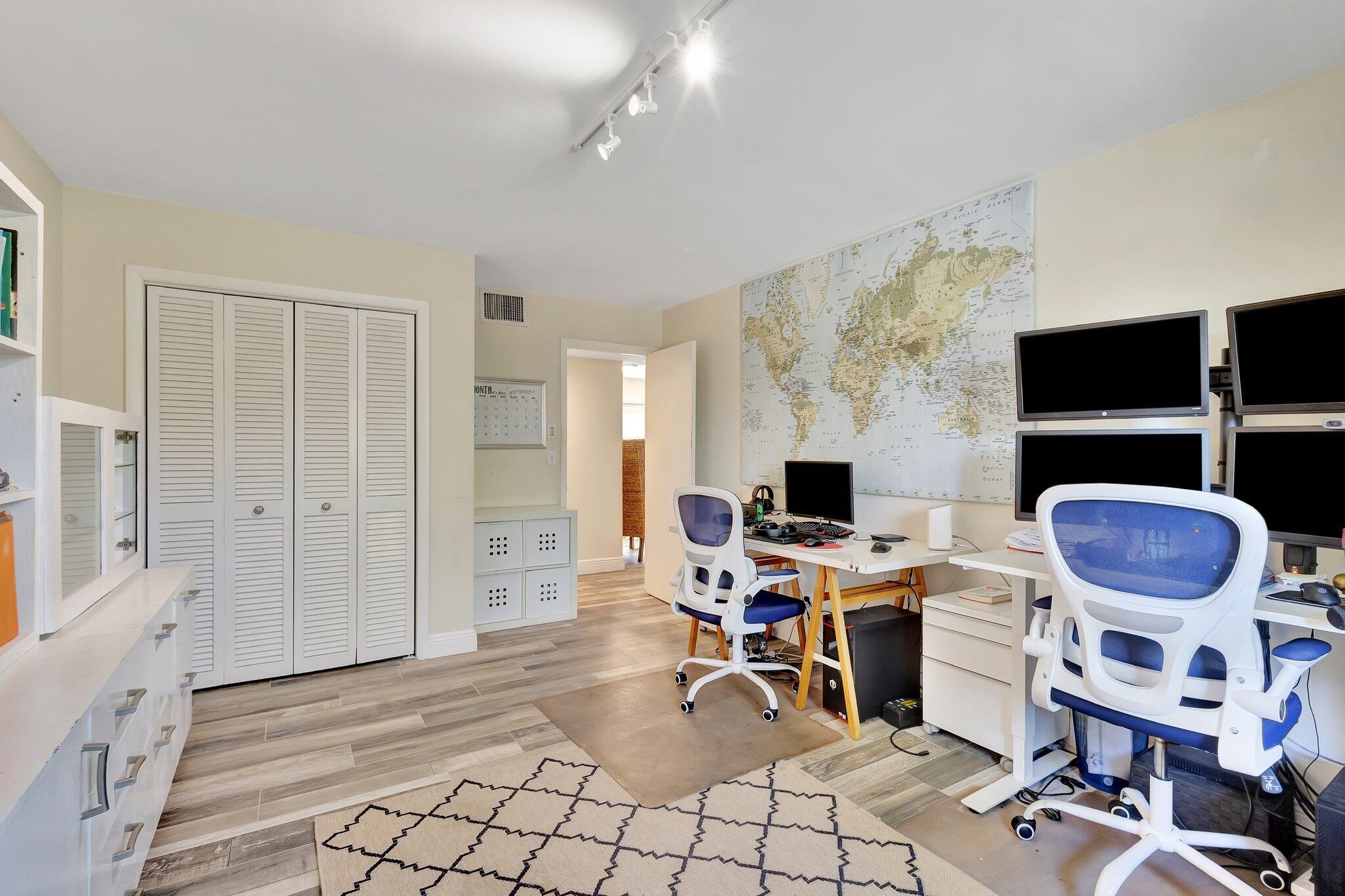 5446 Reynolds Road Lake Worth, FL 33449 - Photo 19 of 57 a view of a workspace with furniture and a fireplace