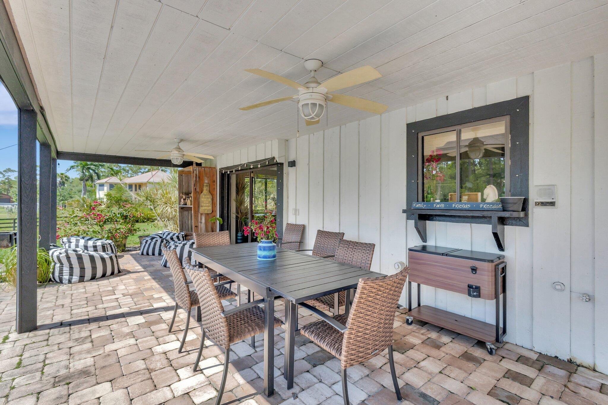 5446 Reynolds Road Lake Worth, FL 33449 - Photo 35 of 57 a dining room with furniture and window