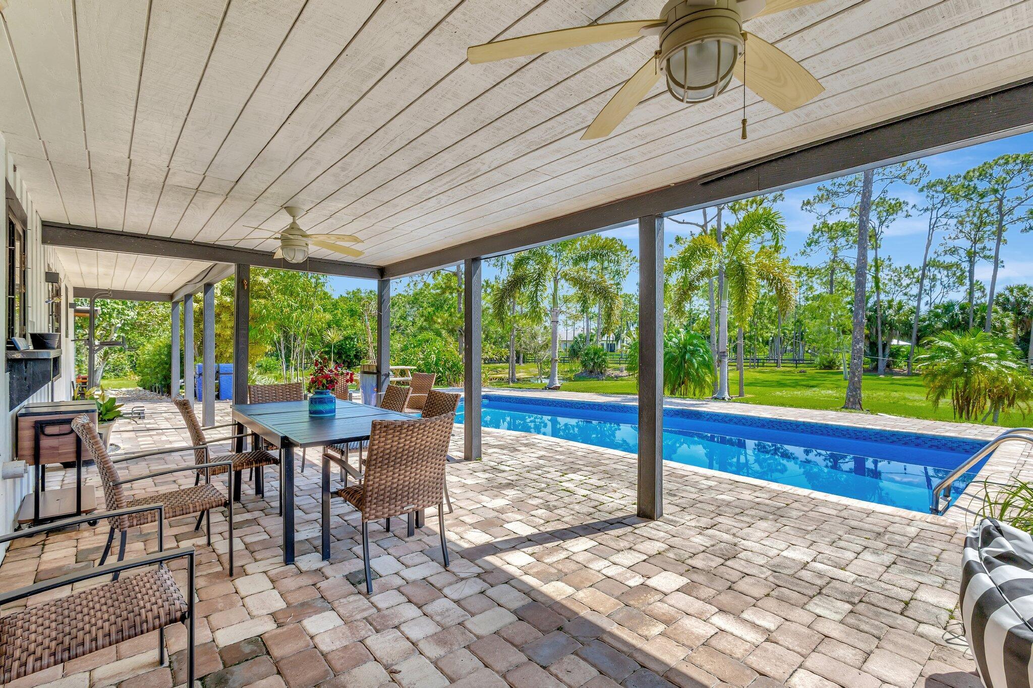 5446 Reynolds Road Lake Worth, FL 33449 - Photo 38 of 57 a outdoor space with chairs