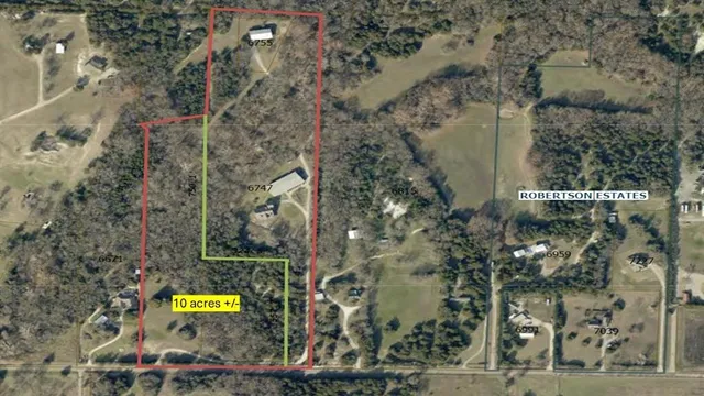 a view of a street with a building in the background