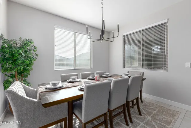 a bed room with a bed tv and a window