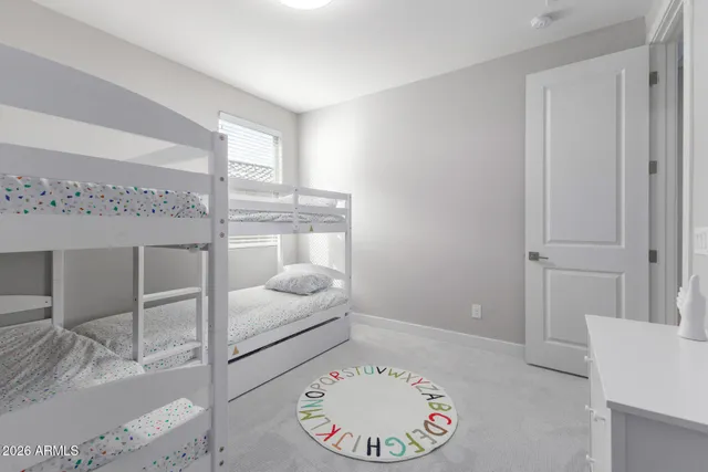 a bedroom with two beds and a couch