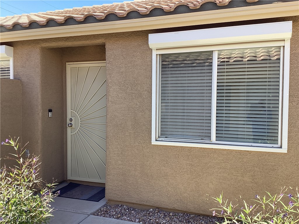 2135 Hidden Ranch Terrace Henderson, NV 89052 - Photo 3 of 27 Welcome to a home featuring a decorative security door and an attractive tile roof.