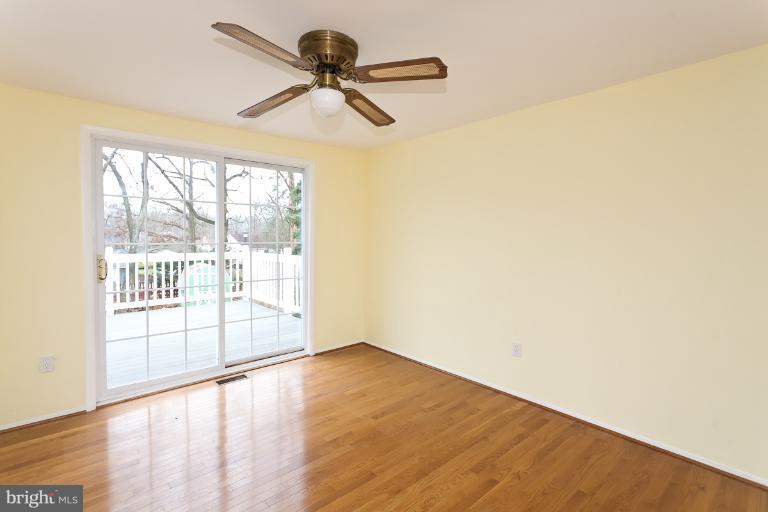 412 Haverhill Road Joppa, MD 21085 - Photo 11 of 20 a view of empty room with wooden floor and fan