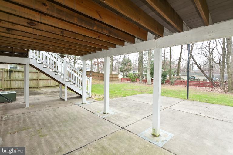 412 Haverhill Road Joppa, MD 21085 - Photo 14 of 20 a view of yard with porch and wooden fence