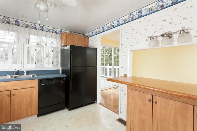 412 Haverhill Road Joppa, MD 21085 - Photo 4 of 20 a kitchen with stainless steel appliances granite countertop a refrigerator and a sink