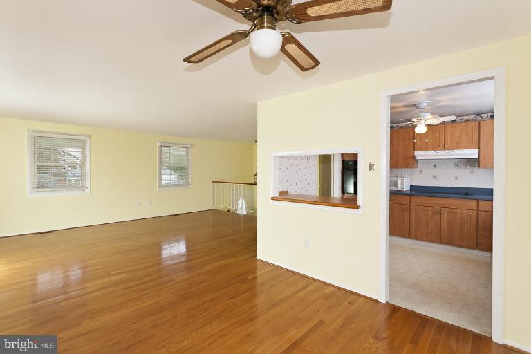 412 Haverhill Road Joppa, MD 21085 - Photo 5 of 20 a view of kitchen with granite countertop cabinets and wooden floor