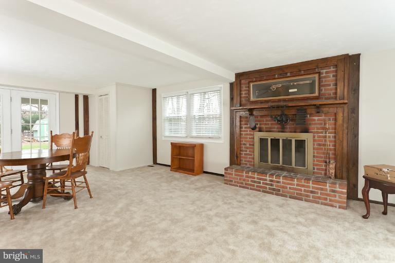 412 Haverhill Road Joppa, MD 21085 - Photo 9 of 20 a view of a livingroom with furniture and a fireplace