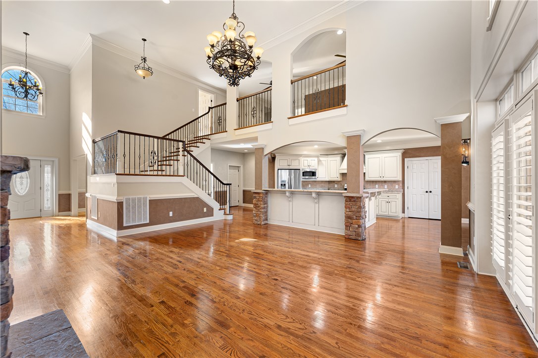 109 Limelight Drive Anderson, SC 29621 - Photo 11 of 34 This grand foyer features soaring ceilings, an elegant staircase, and an inviting open-concept kitchen.