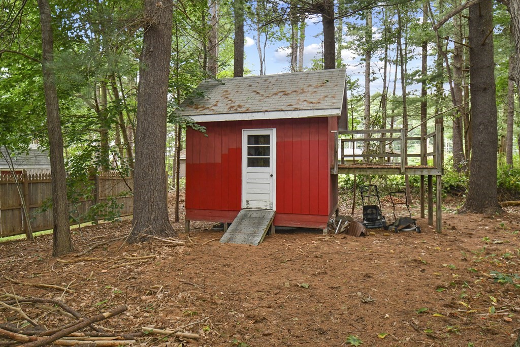 3 Clarissa Road Chelmsford, MA 01824 - Photo 15 of 15 a view of backyard with wooden fence and large trees