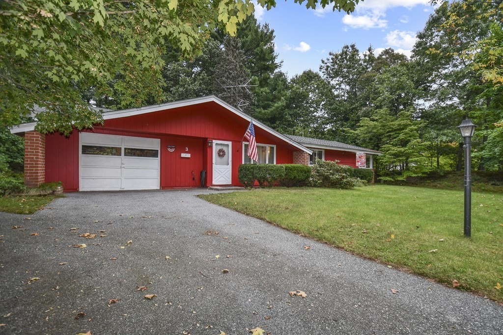 3 Clarissa Road Chelmsford, MA 01824 - Photo 2 of 15 a front view of a house with a yard and garage