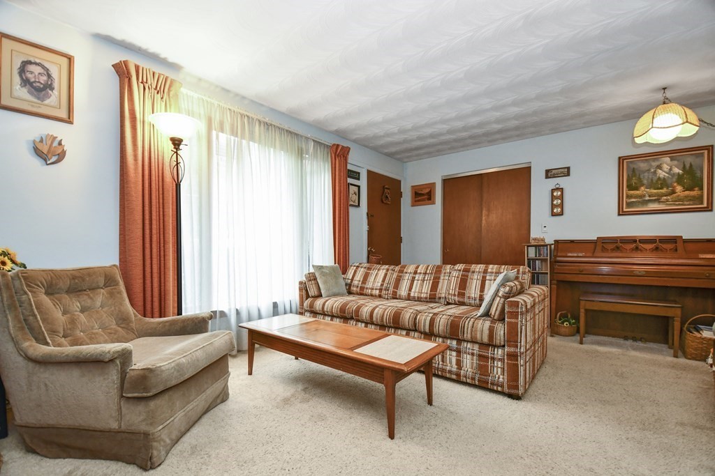3 Clarissa Road Chelmsford, MA 01824 - Photo 3 of 15 a living room with furniture and a window
