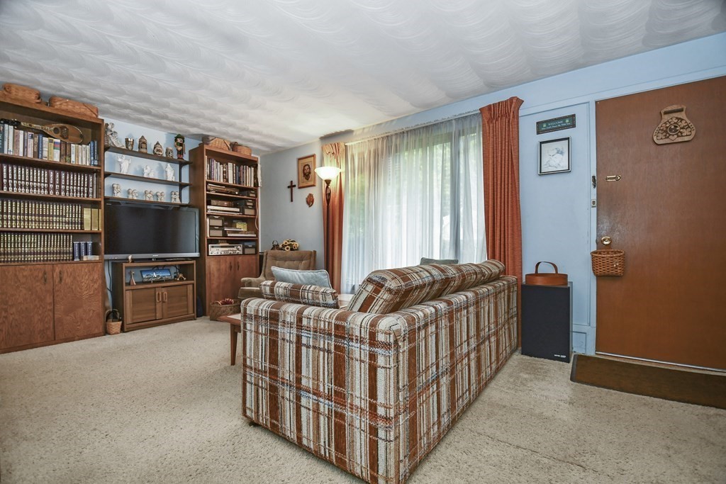 3 Clarissa Road Chelmsford, MA 01824 - Photo 5 of 15 a bedroom with furniture and a book shelf