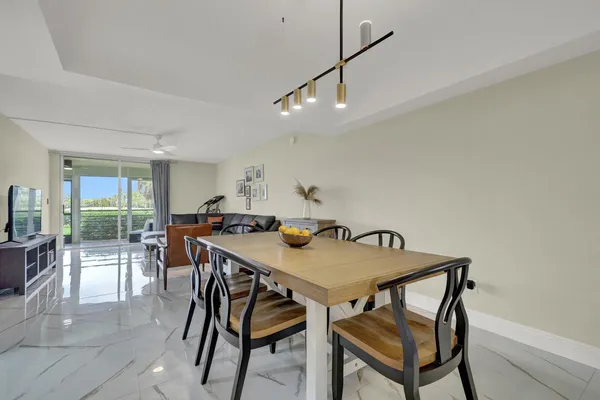 a view of a dining room with furniture and a table